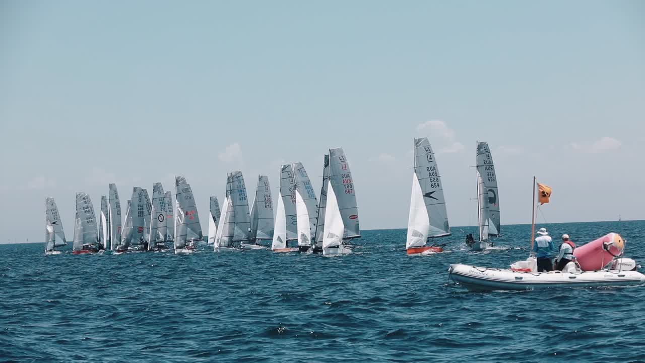 A fleet of International 14 dinghies on the water in the Melbourne 2028 event film